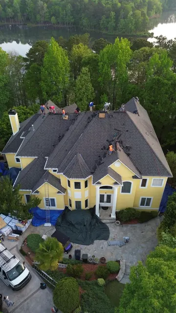 Aerial view of a large residential roofing project in progress