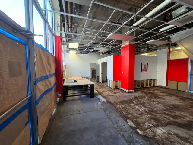 Commercial interior with selective demolition and exposed ceiling systems