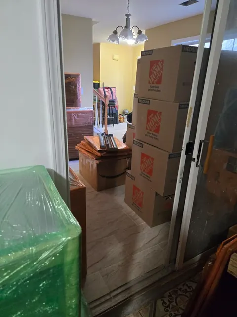 Household contents boxed, wrapped and staged during pack-out