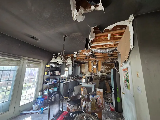 Kitchen with fire damage and opened ceiling assemblies
